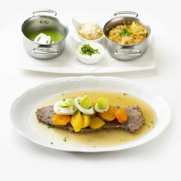 Boiled beef with its classic side dishes (rösti, soup vegetables, creamed spinach and 2 different sauces)